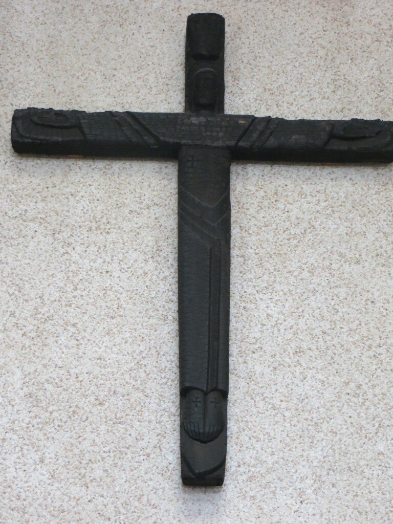 Charred crucifix (1992 fire) relocated in entry hallway.