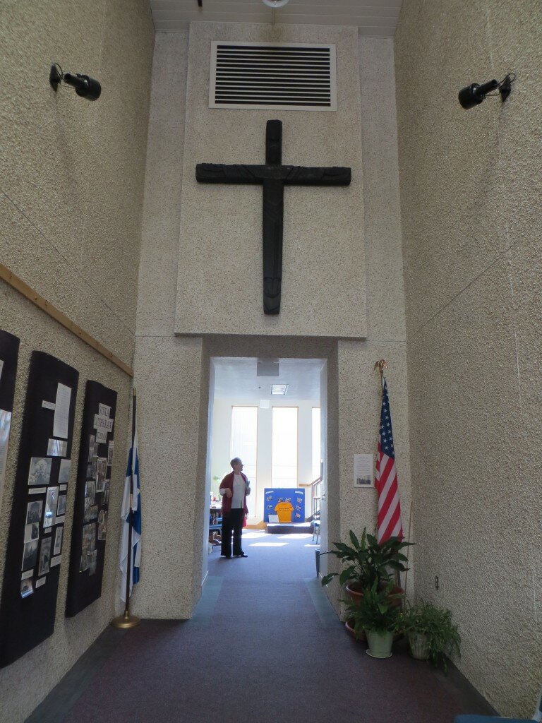 Crucifix (charred from 1992 fire) relocated in entry hall